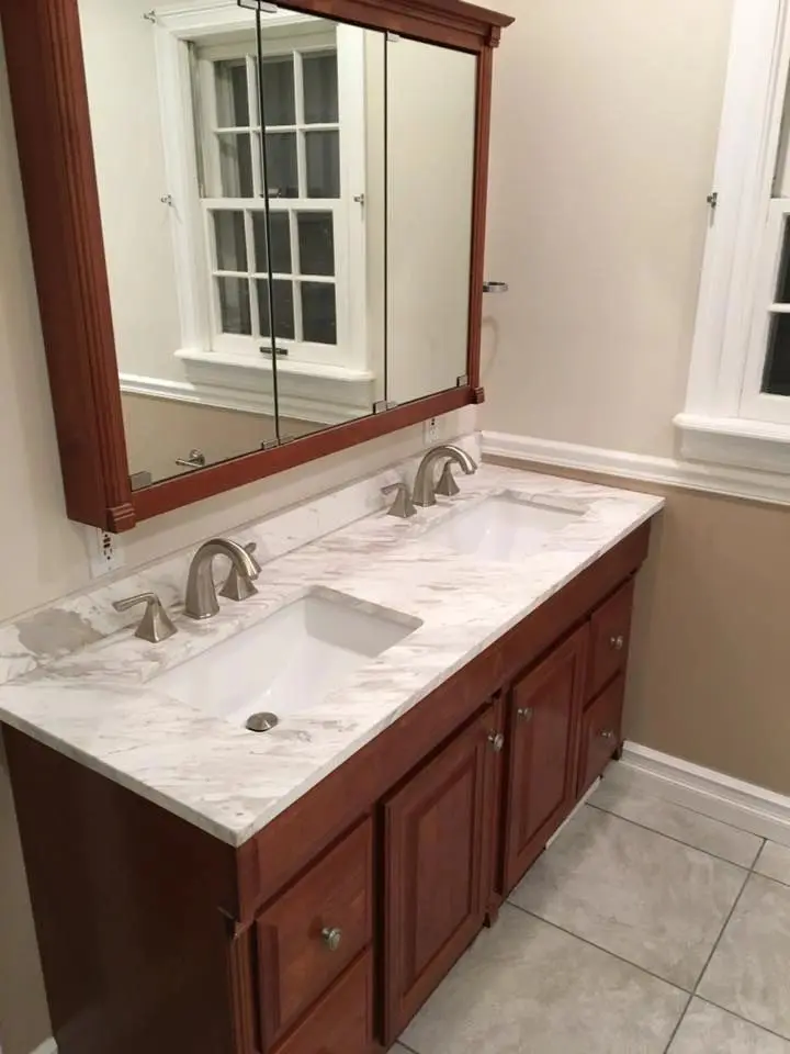 Marble countertop and wooden cabinets